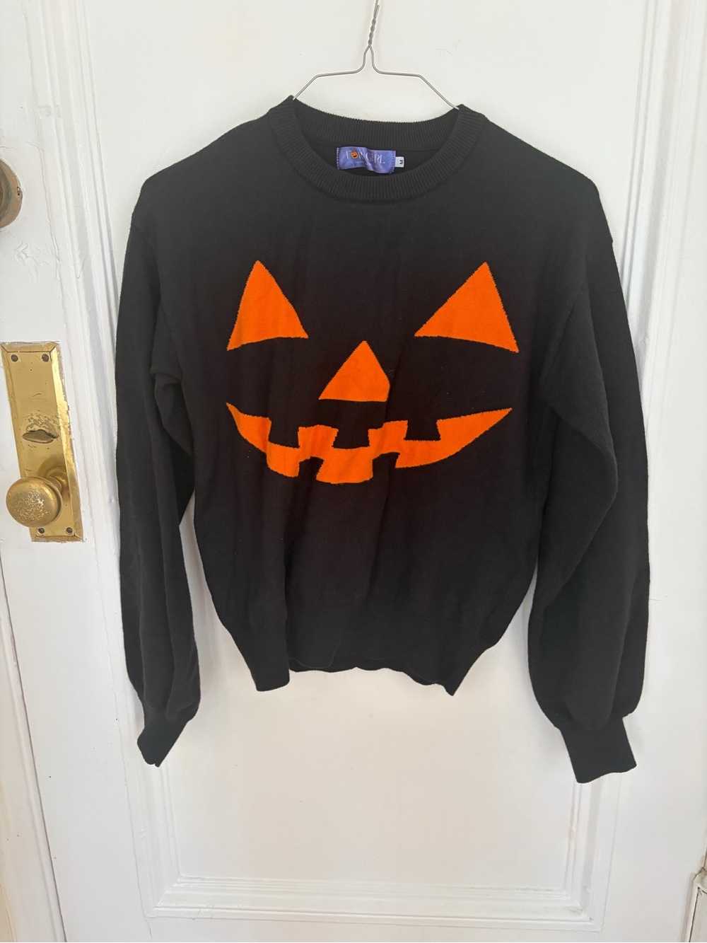 Amazon Black Crewneck Sweater with Orange Jack-O'-Lantern Face